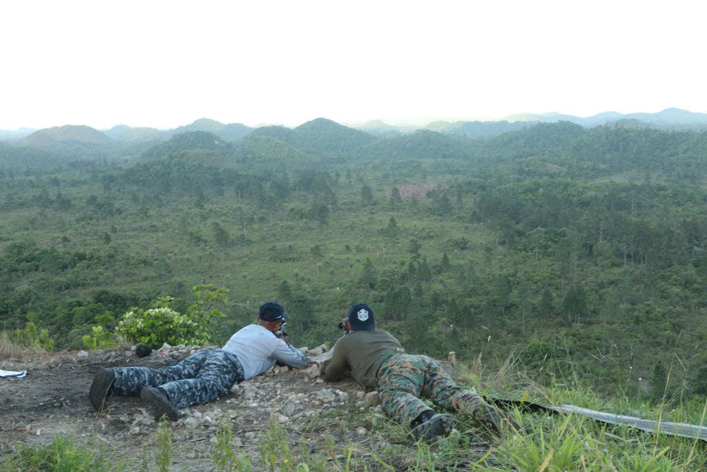 The Panamanian sniper team scans for targets during a live-fire exercise as part of last year's Fuerzas Comando. (U.S. Army photo by Staff Sgt. Michael Carden)