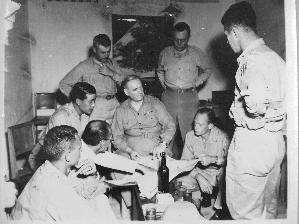 Donovan conferring with OSS agents in China