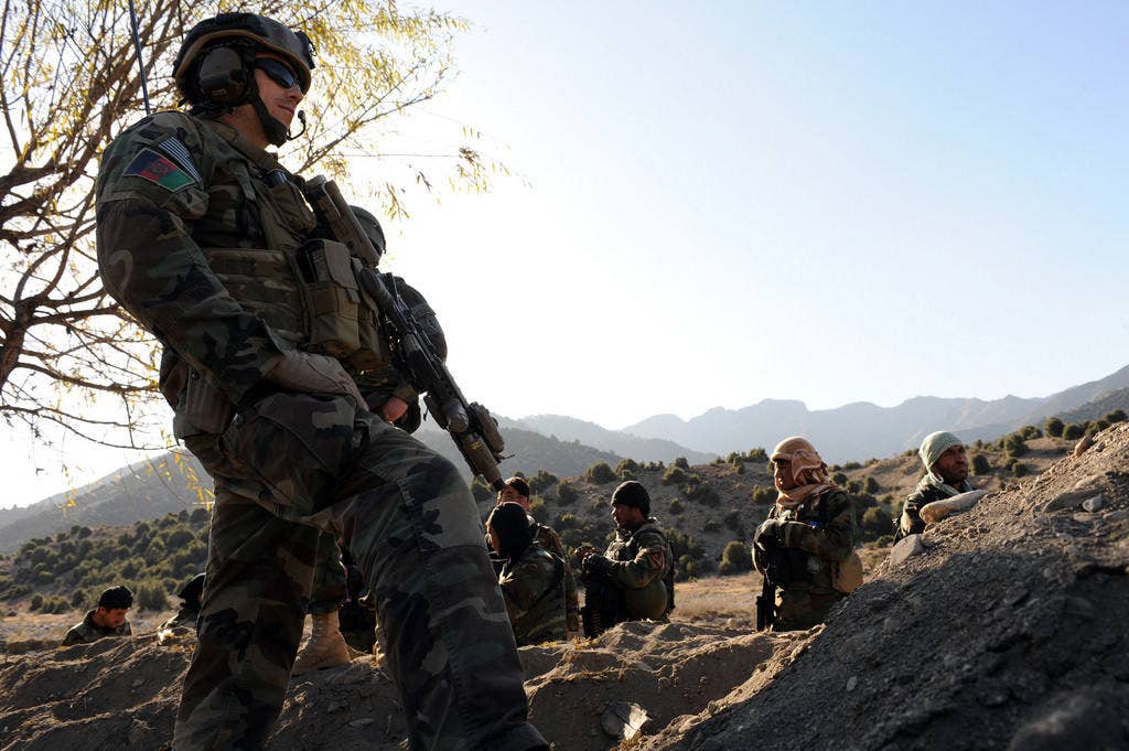 A U.S. Special Forces soldier patrols with Afghan Commands from the 2nd Commando Kandak. Photo: US Army