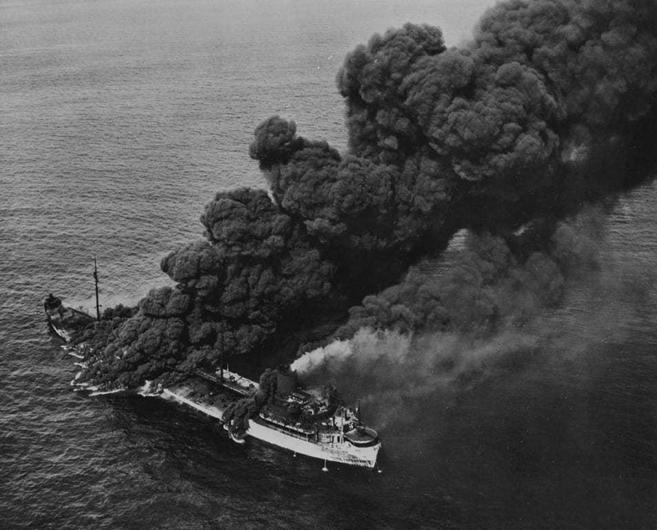 A Merchant Marine ship burns after a torpedo attack in the Atlantic. Photo: US Navy