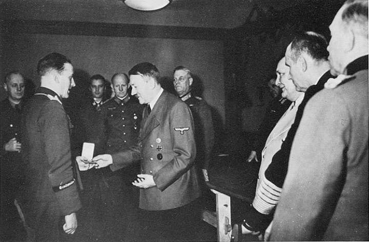 Hans-Ulrich Rudel receives Germany's top medal for bravery from Adolph Hitler. Photo: Public Domain