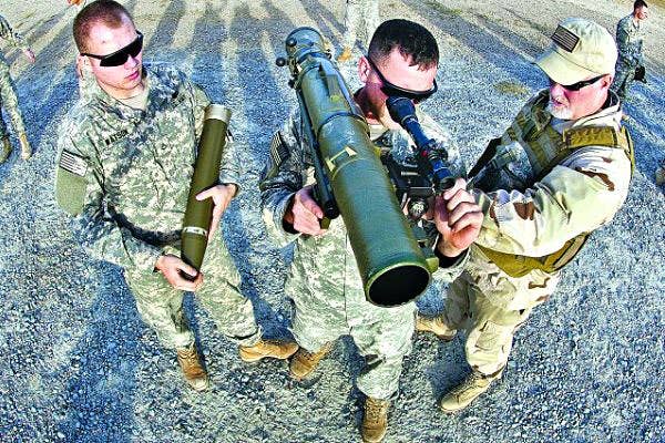 A civilian instructor coaches two paratroopers with the 82nd Airborne Divisions's 1st Brigade Combat Team on how to use a Carl Gustaf 84mm recoilless rifle during a certification class at Fort Bragg, North Carolina. | US Army photo