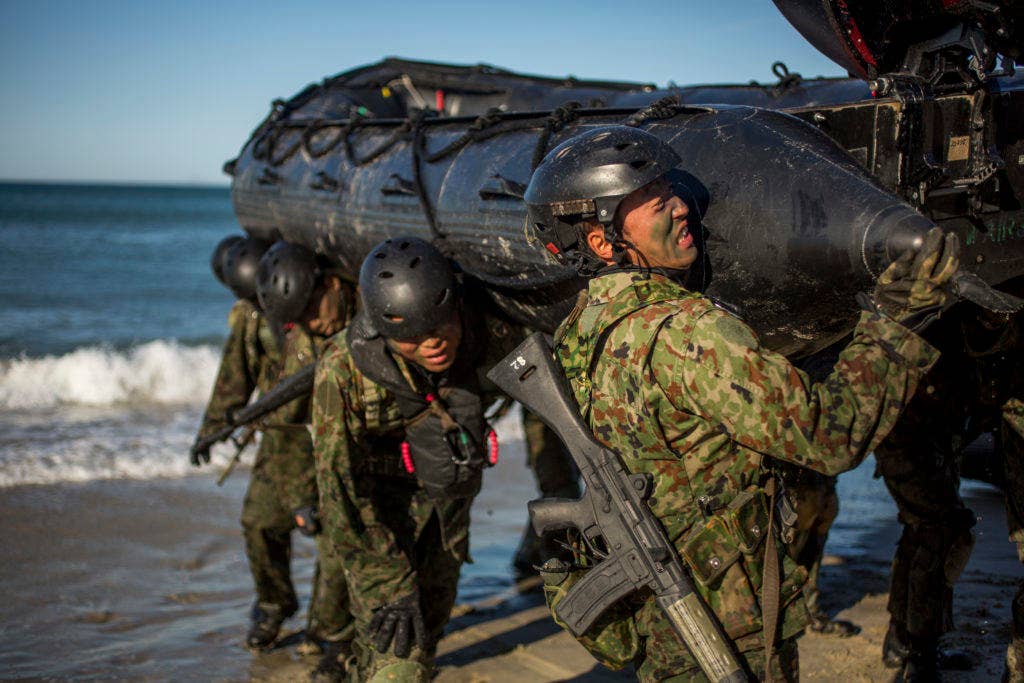 Japanese soldiers with the Japan Ground Self-Defense Force move the F470 Combat Rubber Raiding Craft off the beach during a beach raid as part of training for Exercise Iron Fist 2016, at Marine Corps Base Camp Pendleton, Calif. (U.S. Marine Corps photo by Lance Cpl. Ryan Kierkegaard, 1st Marine Division Combat Camera)