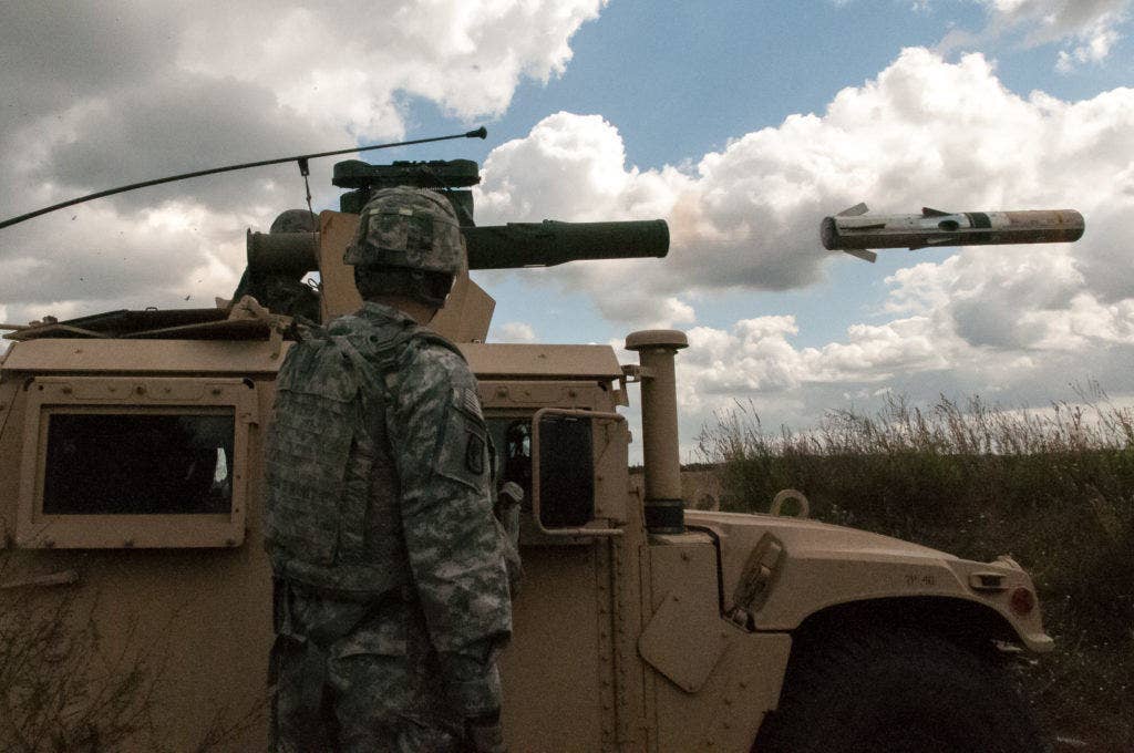 A paratrooper assigned to Company D, 2nd Battalion, 503rd Infantry Regiment, 173rd Airborne Brigade, launches a missile from a Tube-launched, Optically-tracked, Wire-guided missile system at a live-fire training exercise in Drawkso Pomorskie, Poland, as part of Operation Atlantic Resolve Aug. 19. (U.S. Army photo by Spc. Hector Membreno)