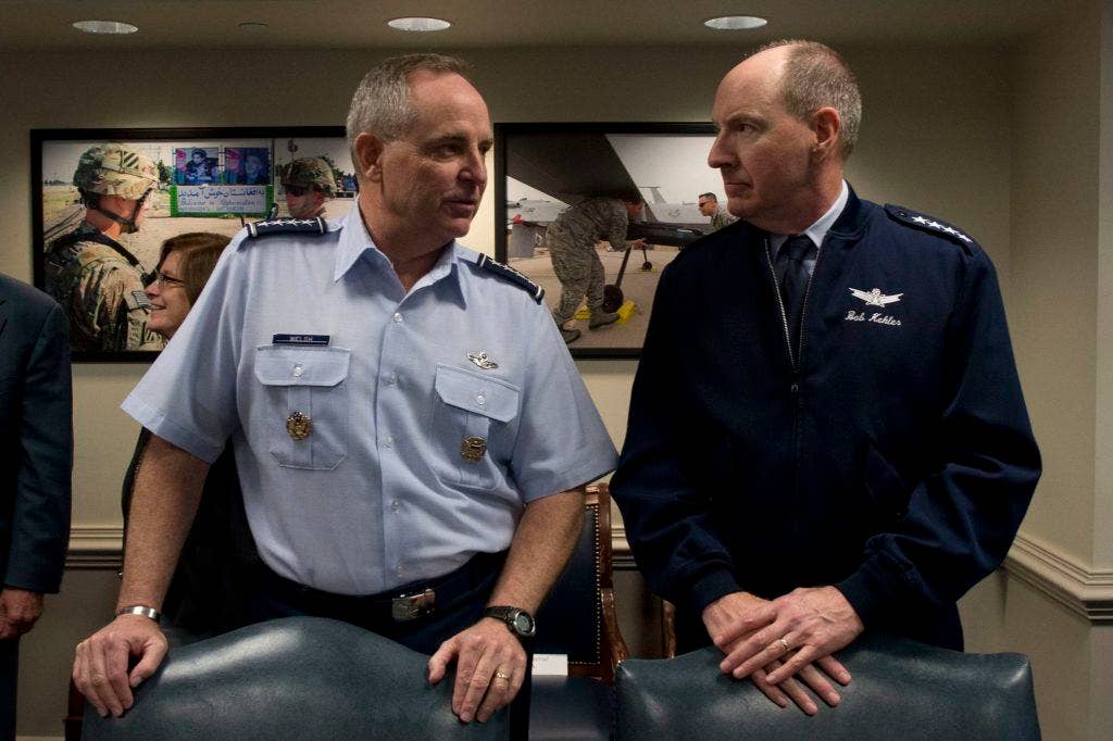 U.S. Air Force Gen. Mark Welsh, left, the chief of staff of the Air Force, speaks with Gen. Bob Kehler, the commander of U.S. Strategic Command, during a senior leadership council meeting hosted by Secretary of Defense Chuck Hagel at the Pentagon.
