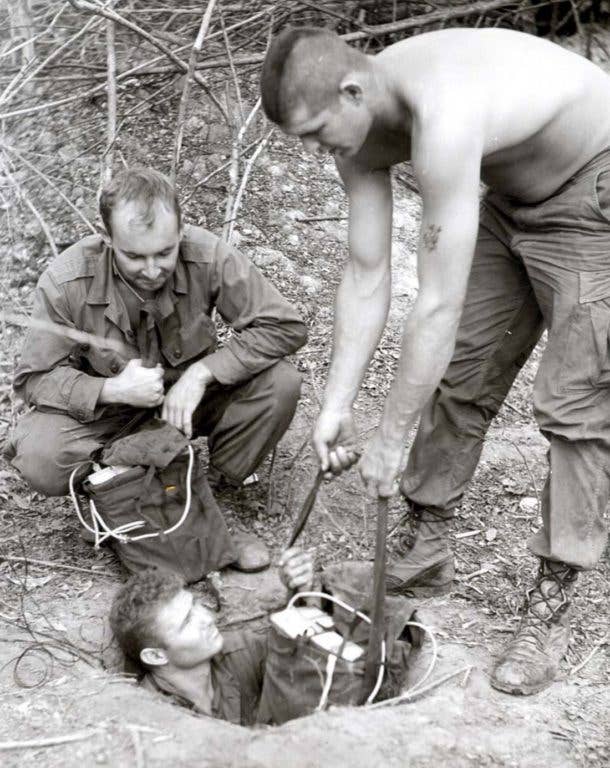 U.S. Army troops investigate a Viet Cong tunnel. | U.S. Army photo