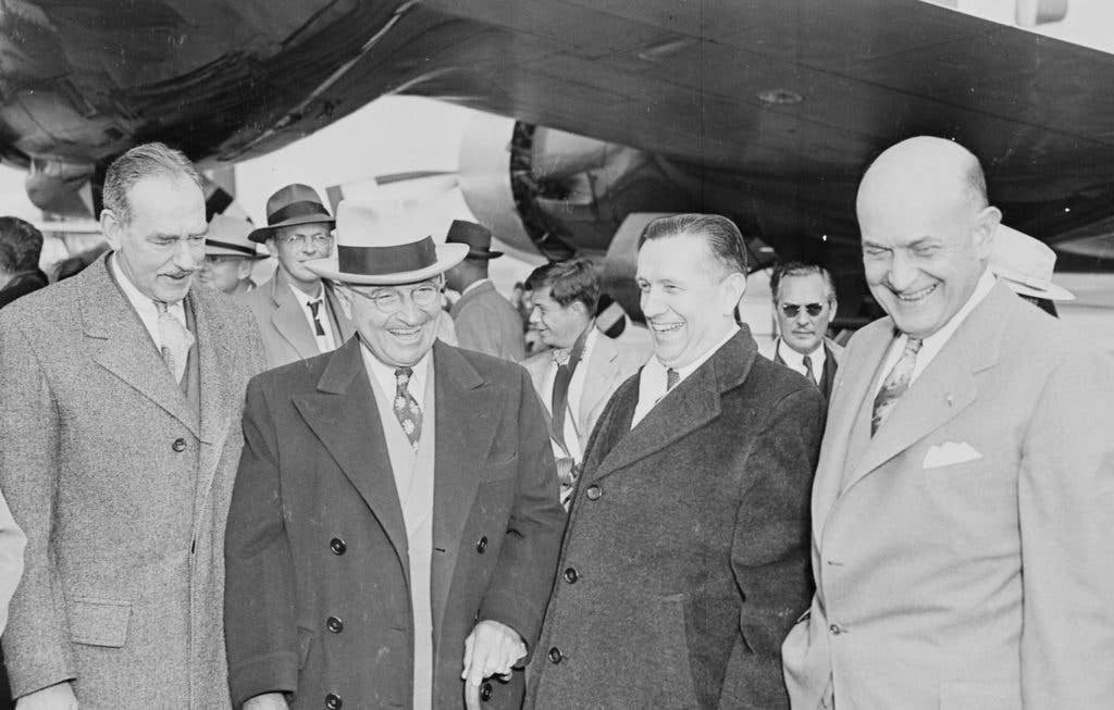 President Truman (second from left) sharing a laugh with Secretary of Defense Johnson (far right) (Photo: DoD Archives)