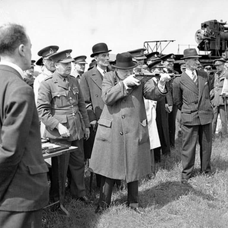 Winston Churchill, no mean shot, was a fan of the Sten gun. Here he is seen test-firing a Sten at the range.