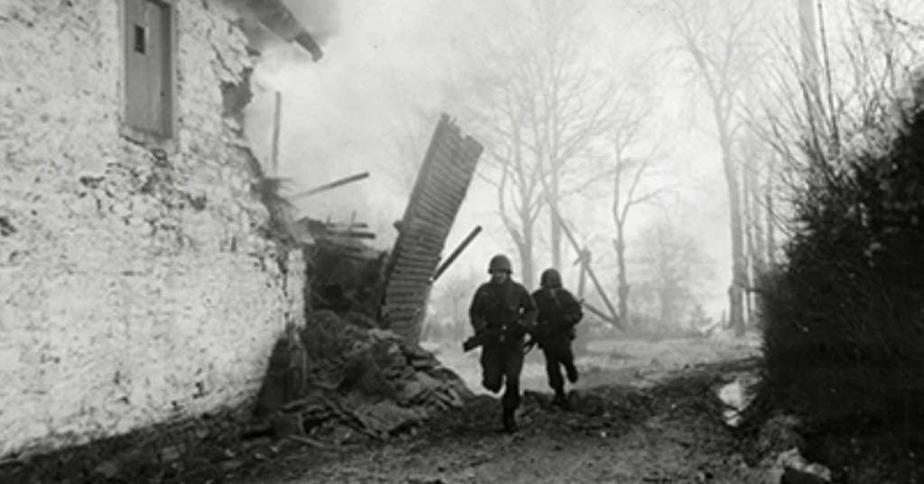 American soldiers rush during an artillery attack in the Battle of the Bulge. (Photo: U.S. Army)