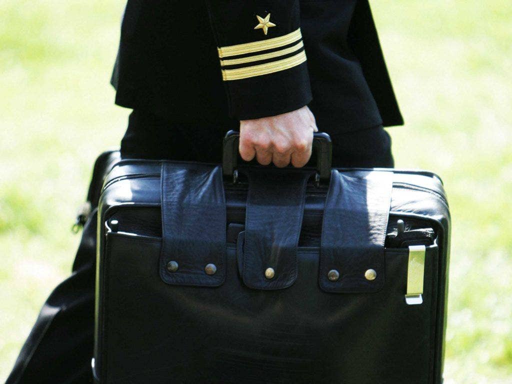 The military aide with 'the football.' (Photo: Business Insider)