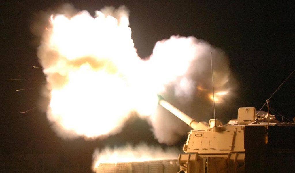A U.S. Army Paladin fires at night. Photo: US Army Spc. Ryan Stroud