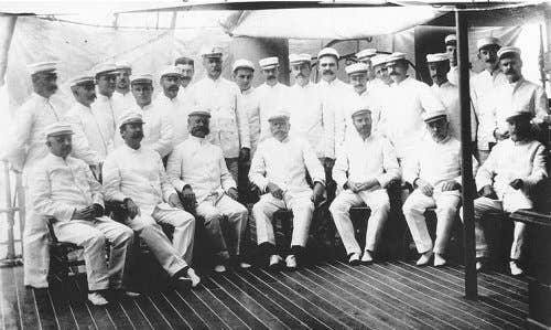 Rear Admiral George Dewey with staff and ship's officers, on board USS Olympia, 1898.