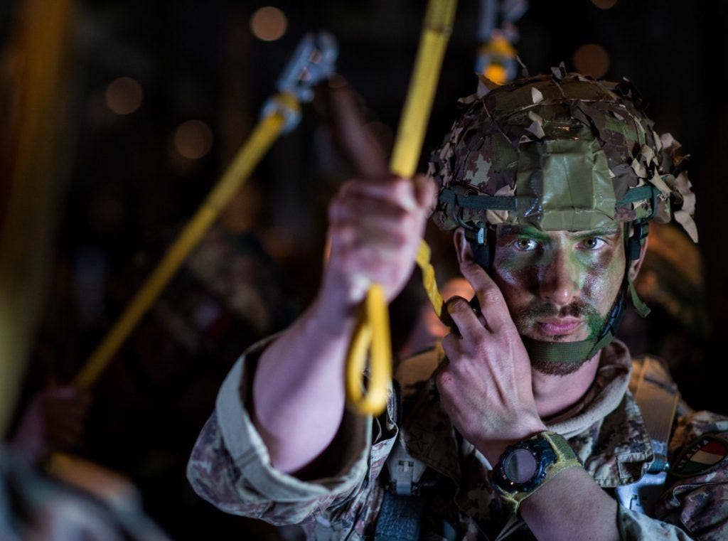 An Italian paratrooper prepares for a static line jump in a US Air Force C-130J during exercise Swift Response 16. | Staff Sgt. DeAndre Curtiss/US Air Force