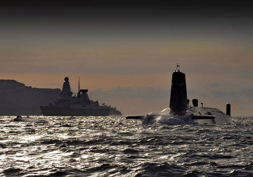 The ballistic missile submarine HMS 'Vanguard' alongside the 'Type 45' destroyer HMS 'Dragon' in 2010. Royal Navy photo