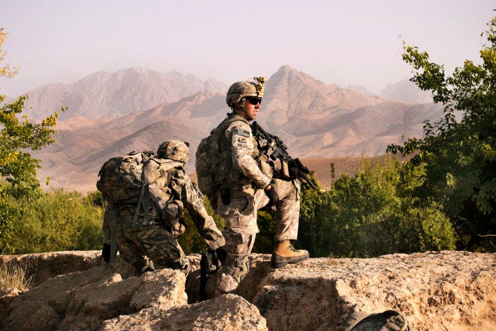 U.S. Soldiers assigned to 3rd Platoon, Fox Company, 2nd Squadron, 2nd Stryker Cavalry Regiment provide security during a village meeting near Combat Outpost Mizan, Zabul province, Afghanistan. U.S. Air Force photo by Senior Airman Nathanael Callon