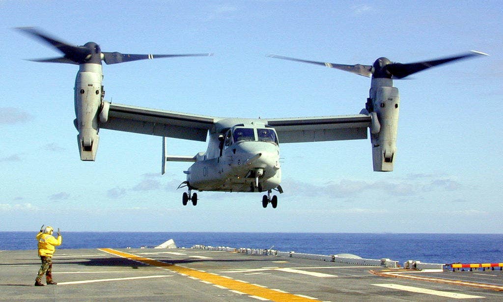 Petty Officer 3rd Class Jerry Lowe directs an MV-22 Osprey in for landing on the flight deck of the USS Essex (LHD 2) off the coast of Southern California on Feb. 26, 2000. (DoD photo by Petty Officer 3rd Class Jason A. Pylarinos, U.S. Navy)