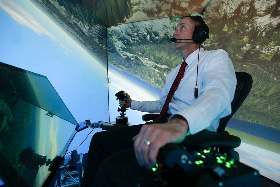 Retired Air Force Col. Geno Lee flies against ALPHA in a simulator. Photo: UC Creative Services Lisa Ventre