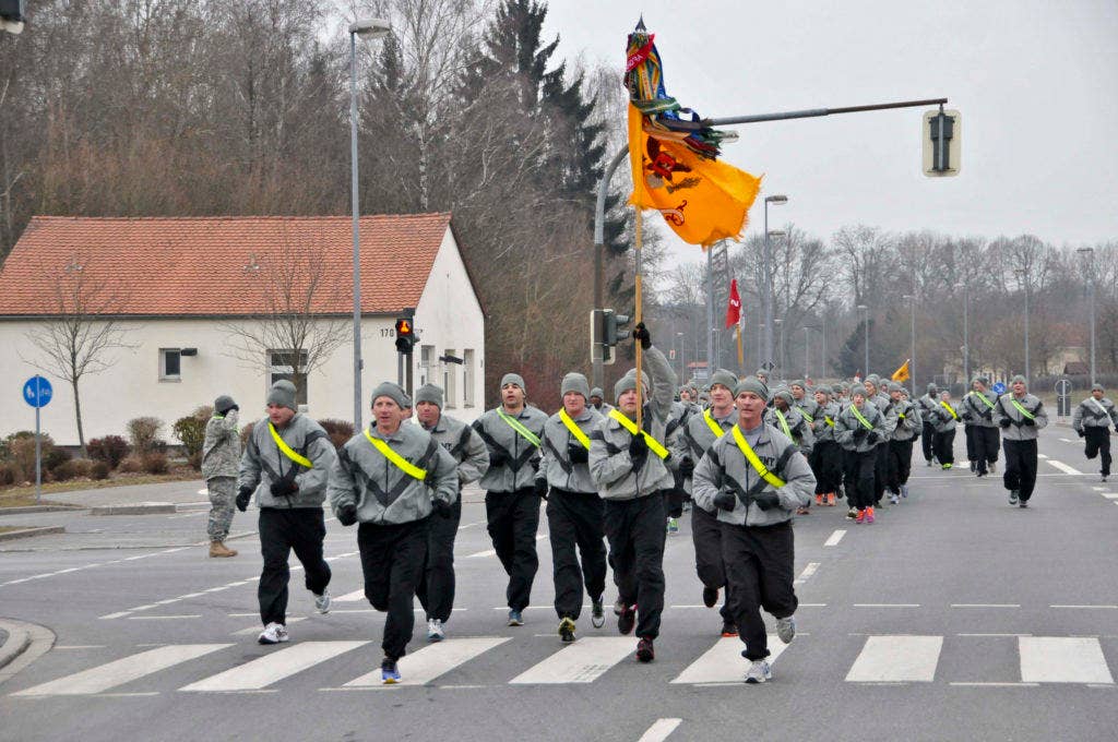 U.S. Army Leaders with 2nd Cavalry Regiment run in the front of a Regimental formation during a morale run March 28, 2013 at Rose Barracks, Germany. Troops with the Regiment ran three miles during morning physical fitness as a morale booster. | U.S. Army Photo by Spc. Joshua Edwards