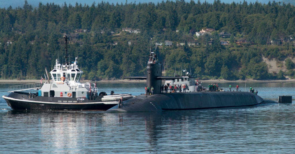 INDIAN ISLAND, Wash. (Aug. 1, 2015) Sailors assigned to the Ohio-class guided-missile submarine USS Michigan (SSGN 727) Blue crew arrive at Naval Magazine Indian Island following a 20-month deployment. (U.S. Navy photo by Mass Communication Specialist 2nd Class Amanda R. Gray/Released)