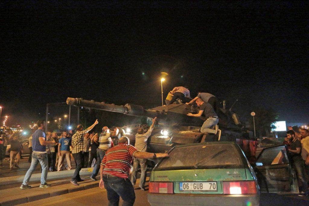 Turkish tanks move into position as Turkish people attempt to stop them in Ankara. Burhan Ozbilici / AP