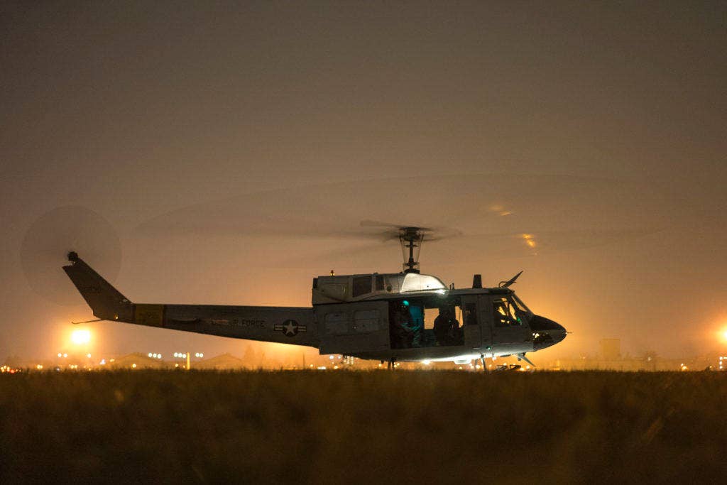 A 459th Airlift Squadron UH-1N Huey prepares for flight at Yokota Air Base, Japan, Feb. 23, 2016. The 459th AS recently improved their search and rescue capabilities by outfitting two UH-1N Hueys with new rescue hoists. (U.S. Air Force photo by Airman 1st Class Delano Scott)