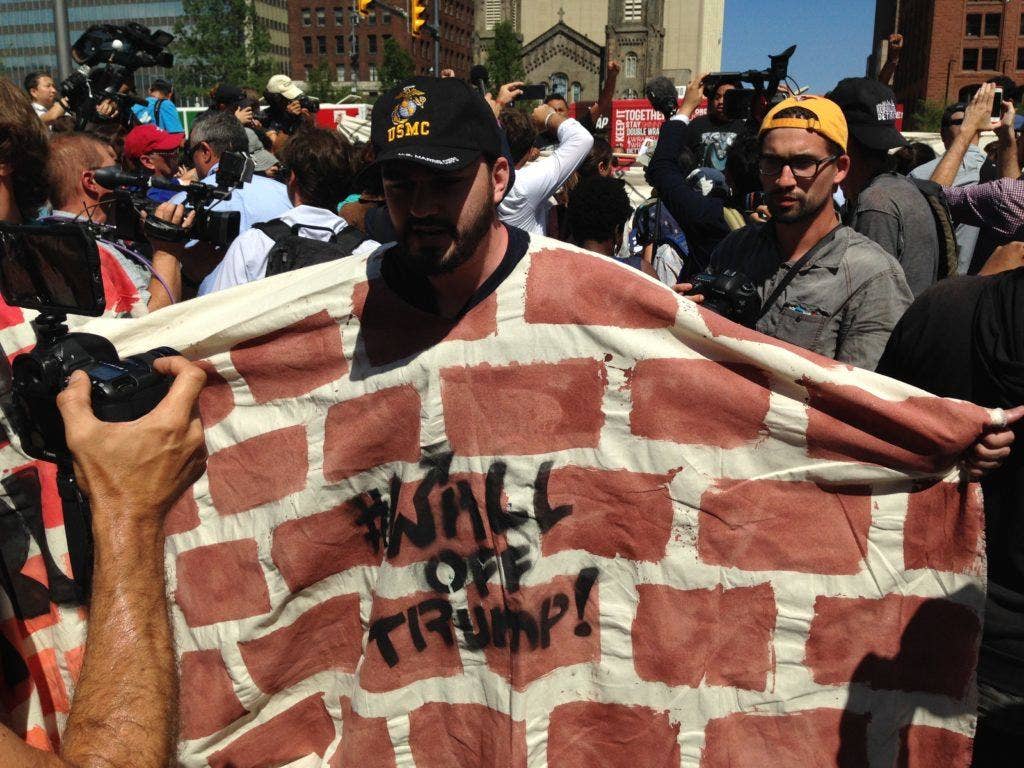 Marine vet Alexander McCoy wears a brick wall poncho at a Vets Vs. Hate protest in Public Square in downtown Cleveland. (Photo: Ward Carroll)