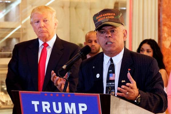 In this May 31, 2016, photo, Republican presidential candidate Donald Trump listens at left as Al Baldasaro, a New Hampshire state representative, speaks during a news conference in New York. | Photo by Richard Drew