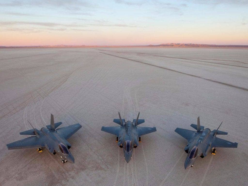 All three F-35 variants at Edwards Air Force Base, Calif. Left to right: F-35C carrier variant, F-35B short takeoff/vertical landing variant, F-35A conventional takeoff and landing variant. | Lockheed Martin