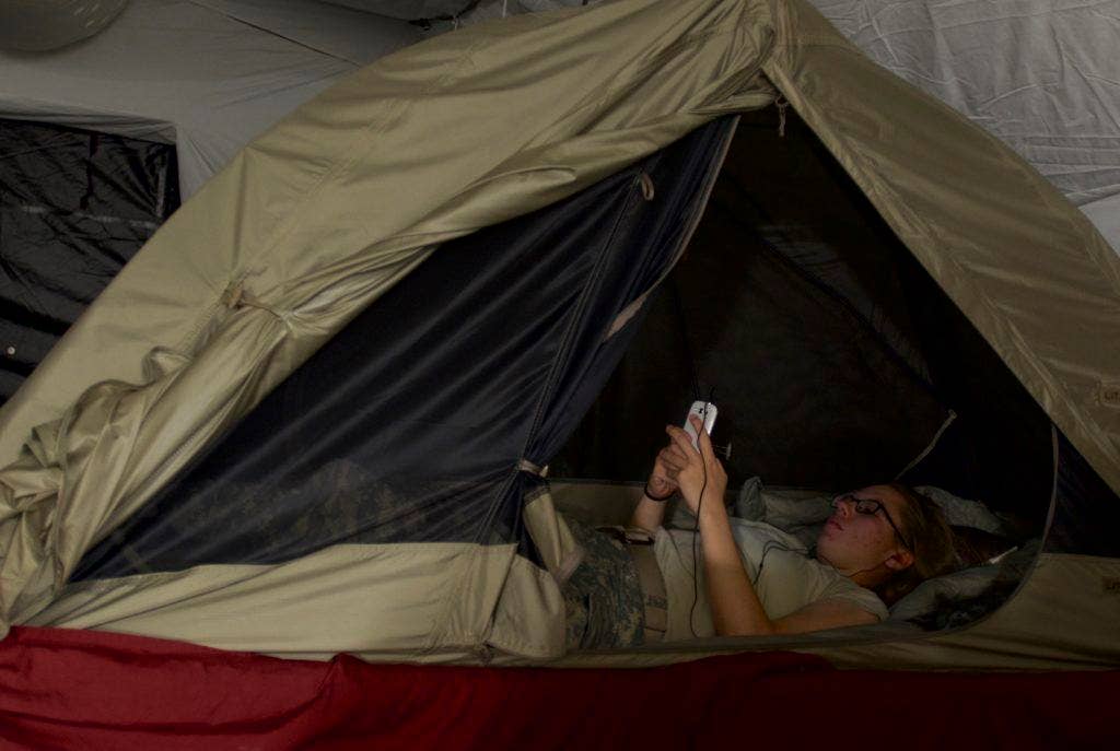 Yes, she is in a pop-up shelter inside of a larger tent. She was also in Liberia during the Ebola epidemic and didn't want to catch malaria which was the more common threat. (Photo: US Army Staff Sgt. V. Michelle Woods)