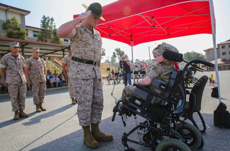 Marine Corps Recruit Depot San Diego presented the title of Honorary Marine to Wyatt Seth Gillette in a ceremony at the School of Infantry-West Parade Deck, Marine Corps Base Camp Pendleton, California, July 30, 2016. | U.S. Marine Corps photo by Angelica Annastas
