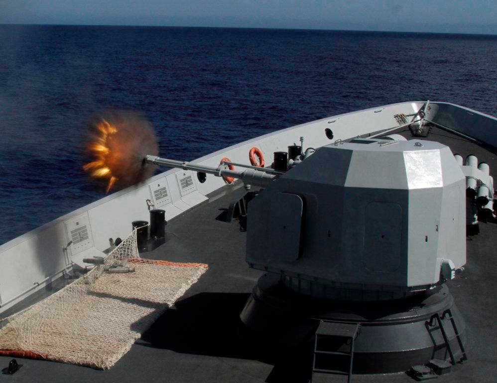 The Chinese Navy frigate Hengshui fires its main gun at a towed target during Rim of the Pacific 2016. (Photo: Chinese Navy Senior Capt. Liu Wenping)