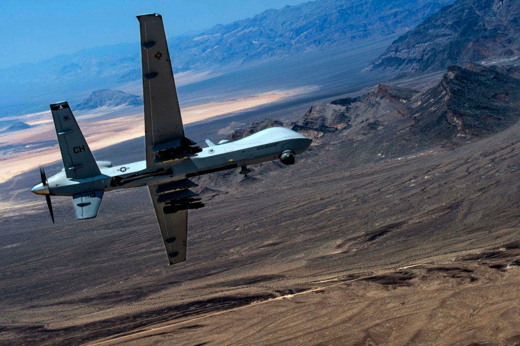 An MQ- Reaper remotely piloted aircraft performs aerial maneuvers over Creech Air Force Base, Nev., June 25, 2015. (Photo: U.S. Air Force Senior Airman Cory D. Payne)