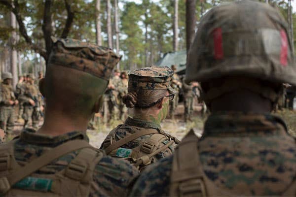U.S. Marines from Delta Company, U.S. Marines from Delta Company, Infantry Training Battalion (ITB), School of Infantry-East (SOI-E) listen to a combat order brief before stepping off on a raid, which is part of the Infantry Integrated Field Training Exercise aboard Camp Geiger, N.C. | U. S. Marine Corps photo by CWO2 Mancuso, Paul S. Combat Camera