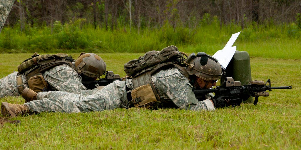 U.S. Army Rangers from 75th Ranger Regiment shoot at targets on Farnsworth Range, Fort Benning, Ga., July 27, as part of a stress fire competition as one of the events of Ranger Rendezvous 2011. (U.S. Army Photo by Sgt. Marcus Butler, USASOC Public Affairs)