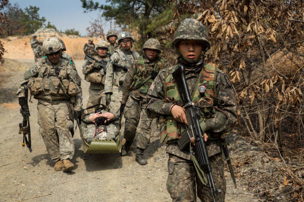 U.S. Soldiers move a casualty toward a designated casualty collection point (CCP) with their Republic of Korea (ROK) Army Soldier counterparts near the DMZ, Republic of Korea, March 21, 2015. The training was conducted during joint training exercise Foal Eagle 2015. (U.S. Army photo by Spc. Steven Hitchcock)