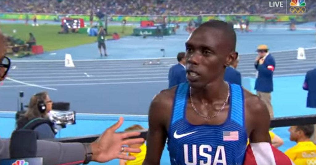 Army Spc. Paul Chelimo hears during an interview that he was disqualified for stepping over a boundary line. His medal was later re-instated. (Photo: YouTube/NBC Sports)