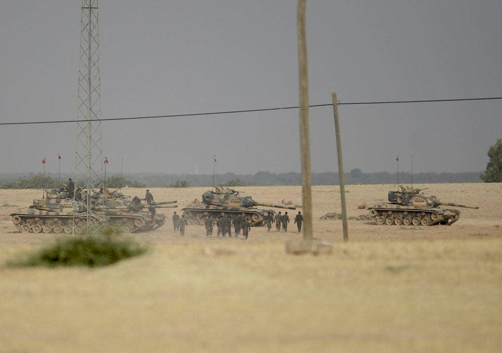 Turkish Armed Forces shells a group of YPG terrorists in the west of Jarablus. (Turkish military photo via Twitter)