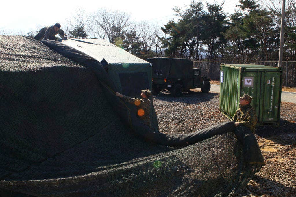 U.S. Marines with Combat Logistics Detachment 391, 3d Transportation Support Battalion, set up a command operation center on Camp Mujuk, South Korea, in support of exercise Ssang Yong, Feb. 29, 2016. (U.S. Marine Corps photo by MCIPAC Combat Camera Sgt. Joseph Sanchez/Released)