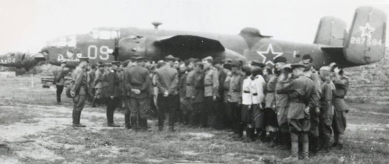Russian airmen in front of a Soviet B-25 Mitchell bomber.