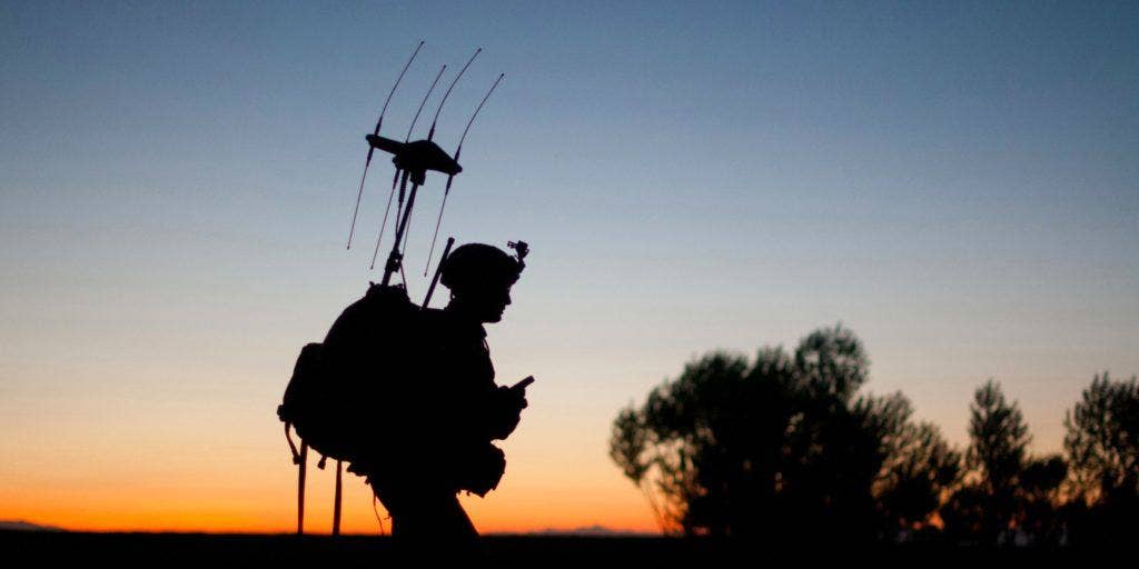 A paratrooper with the 82nd Airborne Division's 1st Brigade Combat Team passes before the rising sun during a patrol into a village May 4, 2012, Ghazni Province, Afghanistan. The equipment on his back is used to block remotely detonated improvised explosive devices. | US Army photo by Sgt. Michael J. MacLeod