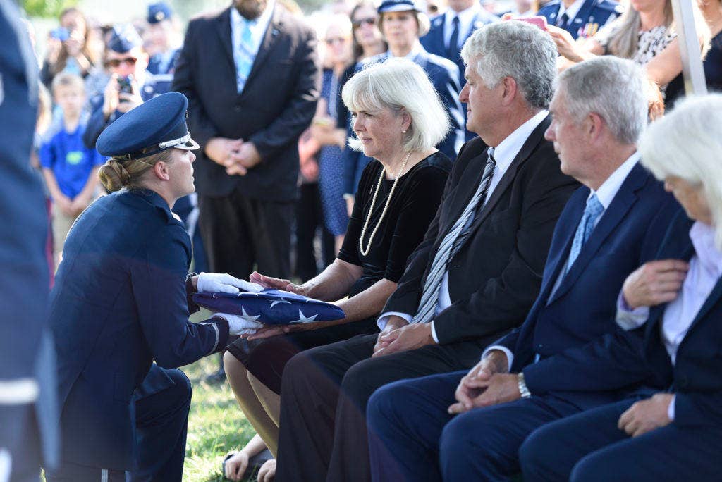 Terry Harmon, the daughter of Women Airforce Service Pilot 2nd Lt. Elaine Harmon, receives the American flag from a member of the U.S. Air Force Honor Guard during her late-mother's interment ceremony at Alrington National Cemetery, Va., Sept. 7, 2016. Harmon died in 2015 at the age of 95. | U.S. Air Force photo by Staff Sgt. Alyssa C. Gibson