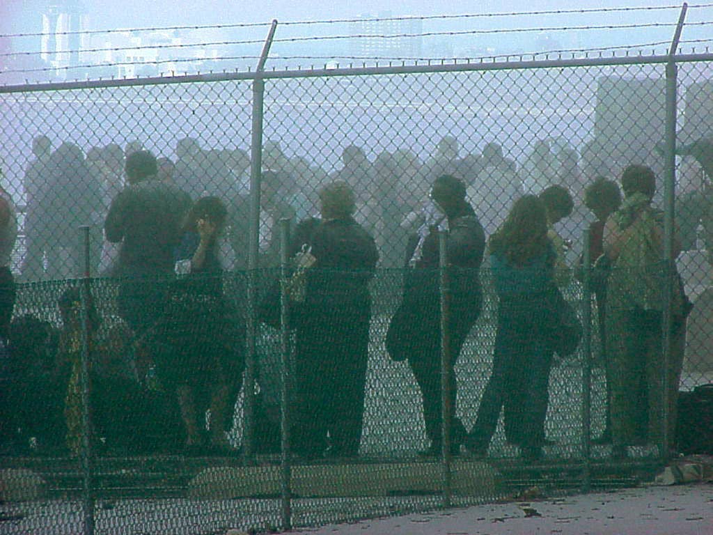New Yorkers rushed to the Lower Manhattan water front at Battery Park to try to escape the collapse of the World Trade Center towers September 11. They were later evacuated by ferries and tugboats from all over New York harbor. (USCG photo by Chief Brandon Brewer)