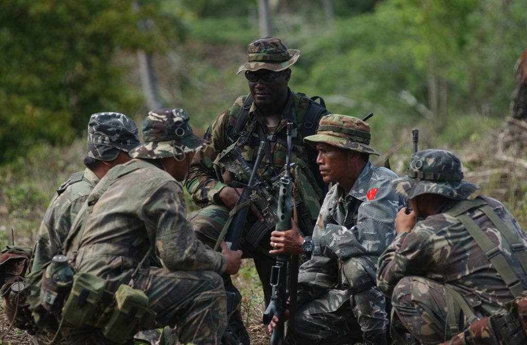 A member of the U. S. Army Special Forces conducts Security Assistance Training for members of the Armed Forces Philippines (AFP). This field training is held on the Zamboanga Peninsula of the Philippine Islands with the Joint Special Operations Task Force Philippines (JSOTF-P) as part of Operation Enduring Freedom. | U.S. Navy Photo by Petty Officer First Class Edward G. Martens