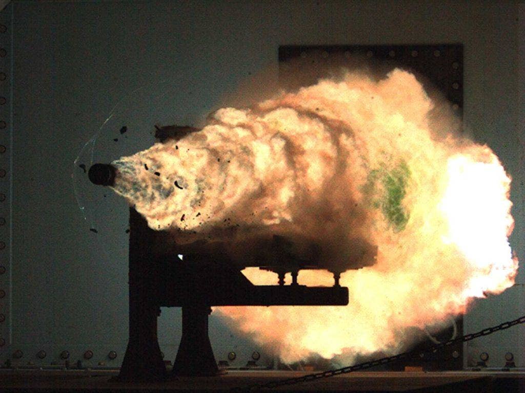 In this image, provided by the U.S. Navy, a high-speed video camera captures a record-setting firing of an electromagnetic railgun, or EMRG, at the Naval Surface Warfare Center, Dahlgren, Va., on Thursday | US Navy