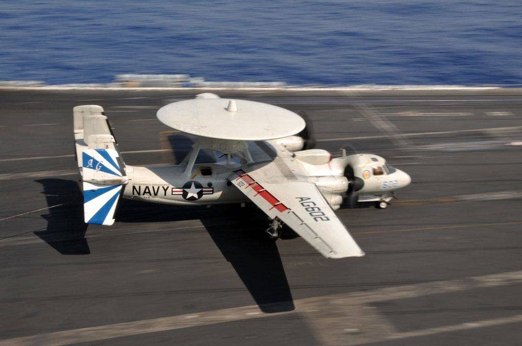 An E-2C Hawkeye from the Bluetails of Carrier Airborne Early Warning Squadron 121 lands aboard the Nimitz-class aircraft carrier USS Dwight D. Eisenhower. | US Navy Photo