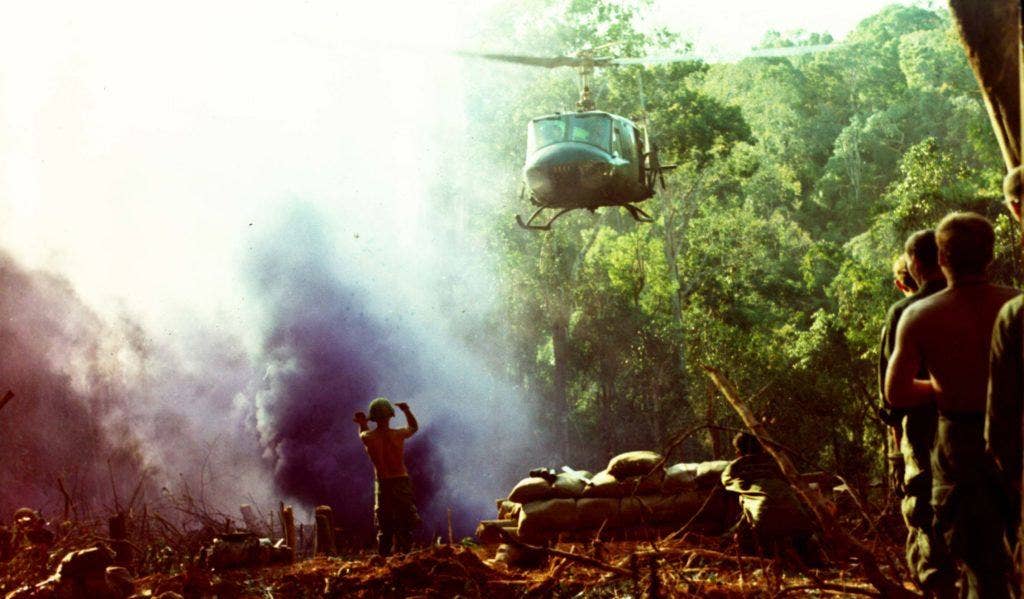 Soldiers on the ground guide in a helicopter during a resupply mission in Vietnam. (Photo: U.S. Army)