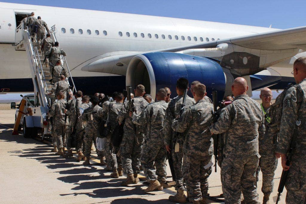 Soldiers board their plane for deployment at Libby Army Airfield. | US Army photo by Gabrielle Kuholski