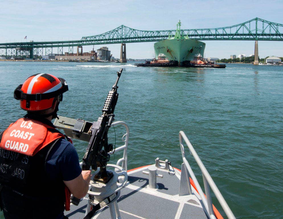 Petty Officer 3rd Class Tanner King, a crewmember of Coast Guard Station Boston, is underway aboard a 45-foot response boat during a security escort in Boston Harbor, Thursday, July 21, 2016. The station's crew escorted the Norwegian-flagged LNG tanker BW GDF SUEZ Boston into a terminal in Boston. U.S. Coast Guard photo by Petty Officer 2nd Class Cynthia Oldham