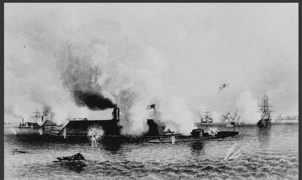 The Monitor fighting the CSS Virginia at the Battle of Hampton Roads. Marines were manning guns on many of the wooden ships seen in the background. (Image: National Archives)