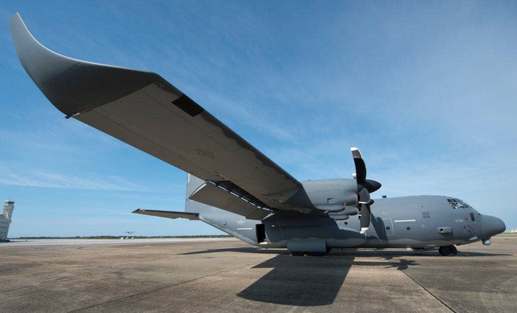 A modified MC-130J awaits its next mission at Eglin Air Force Base, Fla. The aircraft has been fitted with vertical fins on each wing, called winglets. (U.S. Air Force photo/Samuel King Jr.)